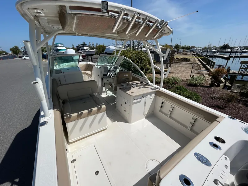 Slide: The Image of Interior view of a 2018 Sailfish 275 DC boat at the marina. - 11