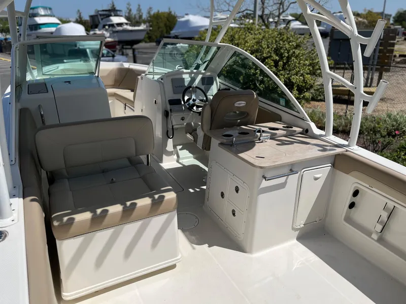 Slide: The Image of Interior view of a 2018 Sailfish 275 DC boat with seating area. - 12