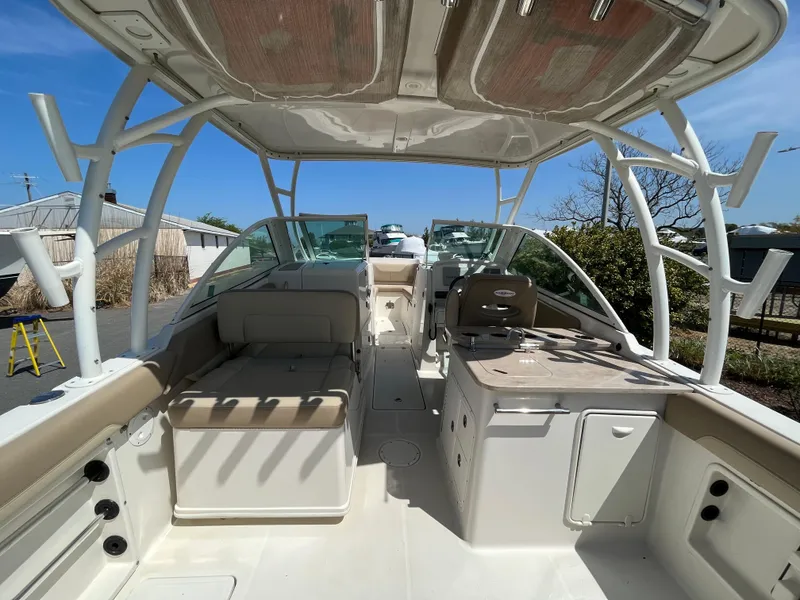 Slide: The Image of Interior view of a 2018 Sailfish 275 DC boat under sunny skies. - 13
