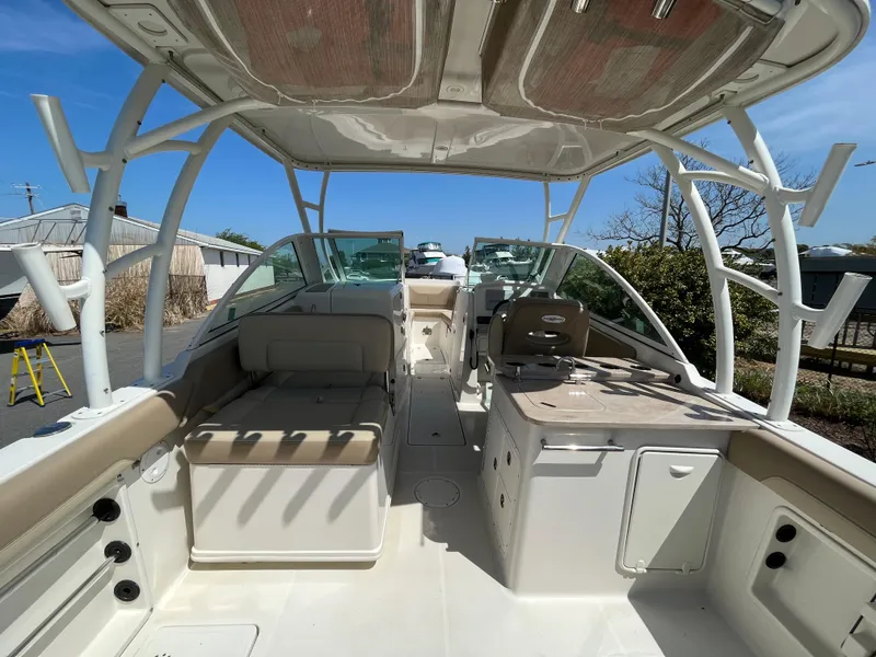 Slide: The Image of Interior view of a 2018 Sailfish 275 DC boat under sunny skies. - 14
