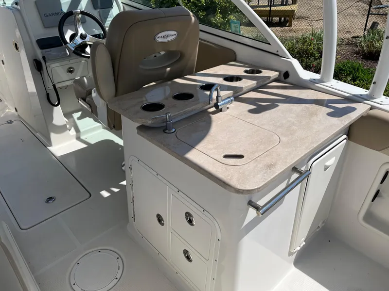 Slide: The Image of Interior of 2018 Sailfish 275 DC with helm and sink. - 16
