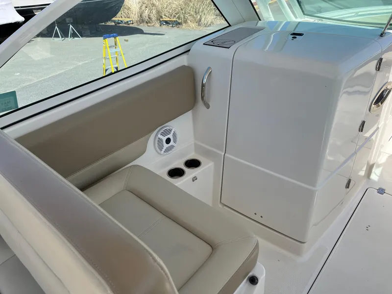 Slide: The Image of Interior of a 2018 Sailfish 275 DC boat with seating area. - 17