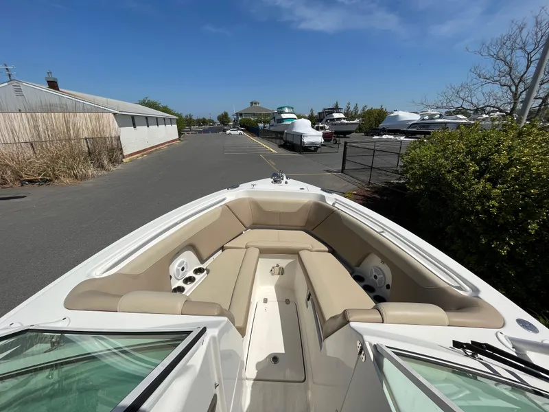 Slide: The Image of Sailfish 275 DC 2018 boat with beige interior at the marina. - 21