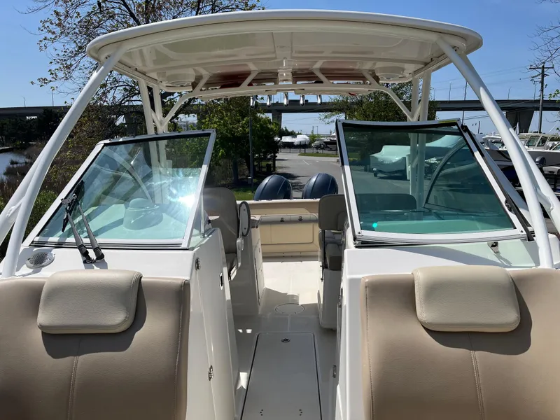 Slide: The Image of Interior view of a 2018 Sailfish 275 DC boat under sunny skies. - 22