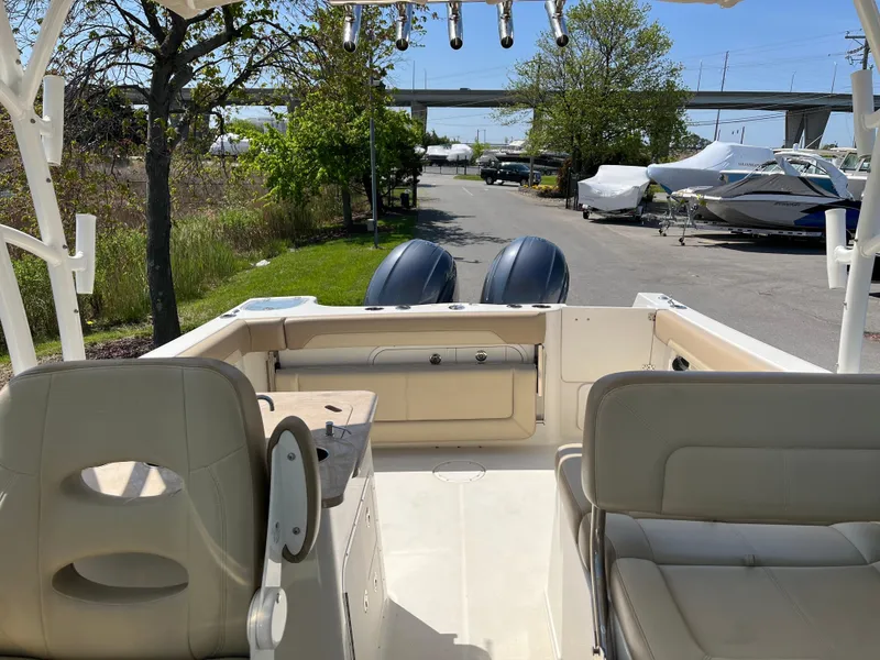 Slide: The Image of Interior view of a 2018 Sailfish 275 DC boat at the marina. - 24