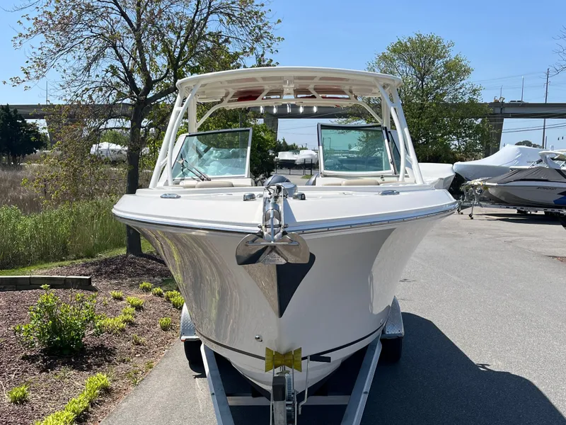Slide: The Image of 2018 Sailfish 275 DC boat on a trailer, side view. - 4