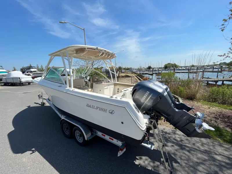Slide: The Image of 2018 Sailfish 275 DC boat with Yamaha engine at marina. - 9