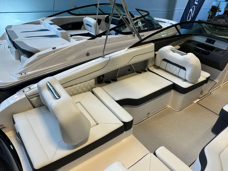 Slide: The Image of 2025 Regal LX2 boat interior with luxurious white seating and sleek design. - 10