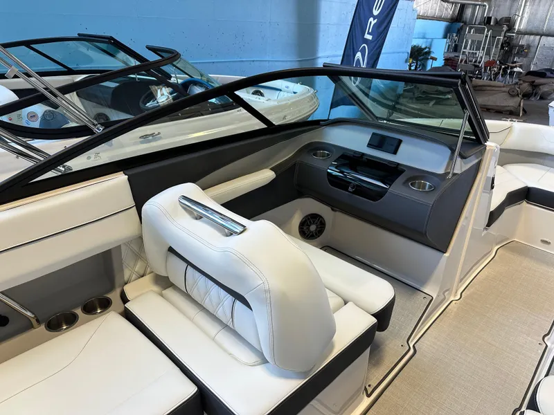 Slide: The Image of 2025 Regal LX2 boat interior with luxurious seating and modern dashboard. - 12