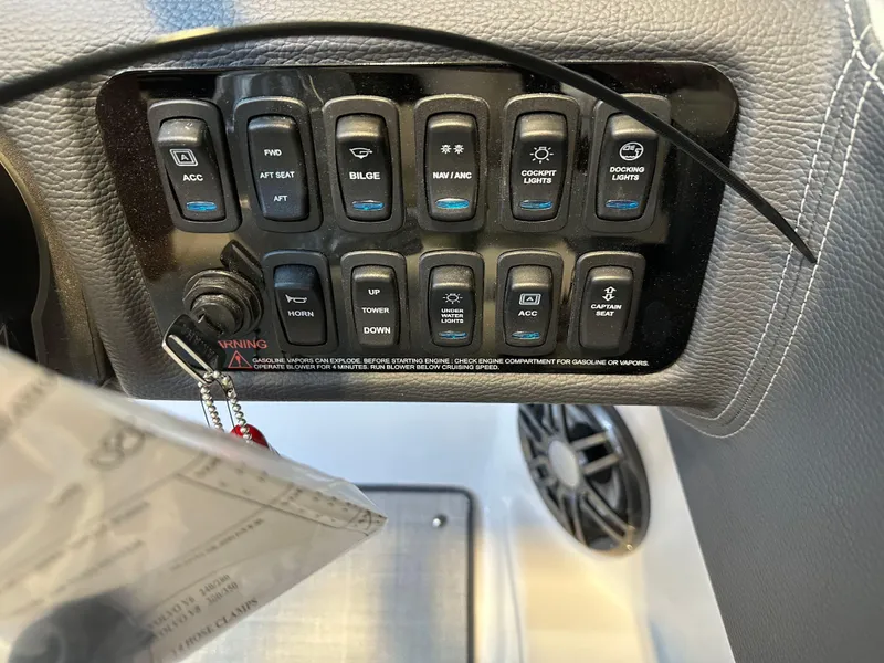Slide: The Image of Control panel of 2025 Regal LX2 boat with various switches and labels. - 16