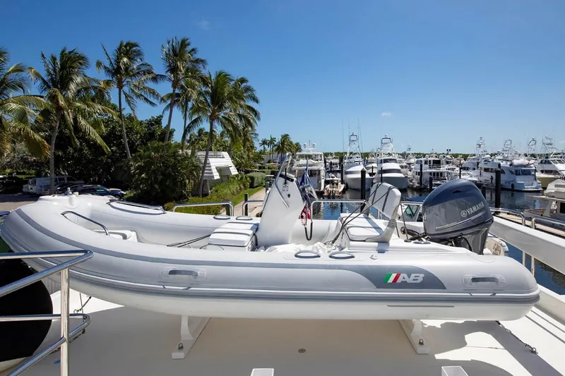 Slide: The Image of 2014 Pacific Mariner 85 Motor Yacht with tender, docked in a sunny marina. - 15