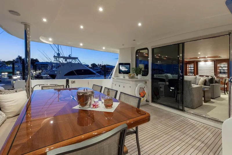 Slide: The Image of Luxurious 2014 Pacific Mariner 85 Motor Yacht with elegant outdoor dining area at sunset. - 20