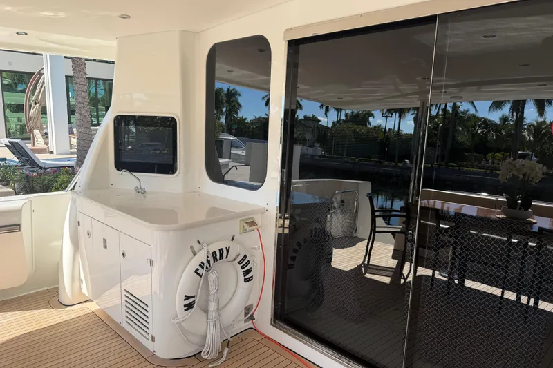 Slide: The Image of 2014 Pacific Mariner 85 Motor Yacht deck with seating and life preserver. - 22