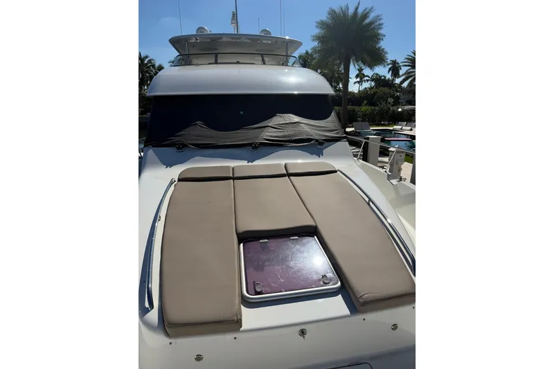Slide: The Image of 2014 Pacific Mariner 85 Motor Yacht with sunbathing deck, docked near palm trees. - 46