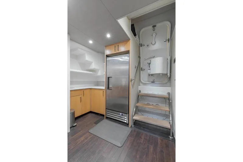 Slide: The Image of Modern kitchen area in 2014 Pacific Mariner 85 Motor Yacht with stainless steel fridge. - 49