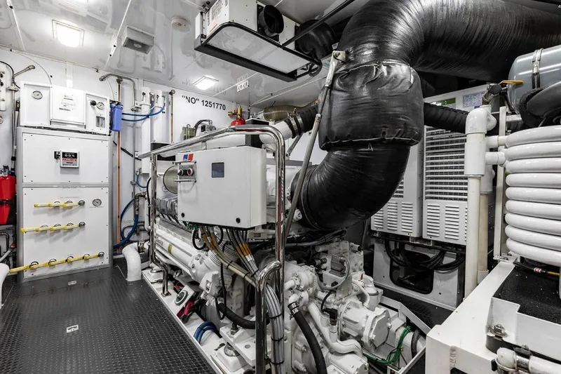 Slide: The Image of Engine room of 2014 Pacific Mariner 85 Motor Yacht, showcasing machinery and equipment. - 54