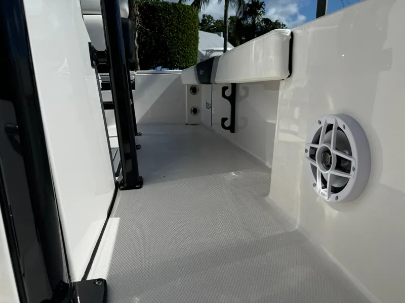 Slide: The Image of 2024 Robalo 226 Cayman boat interior with speaker and storage hooks. - 21