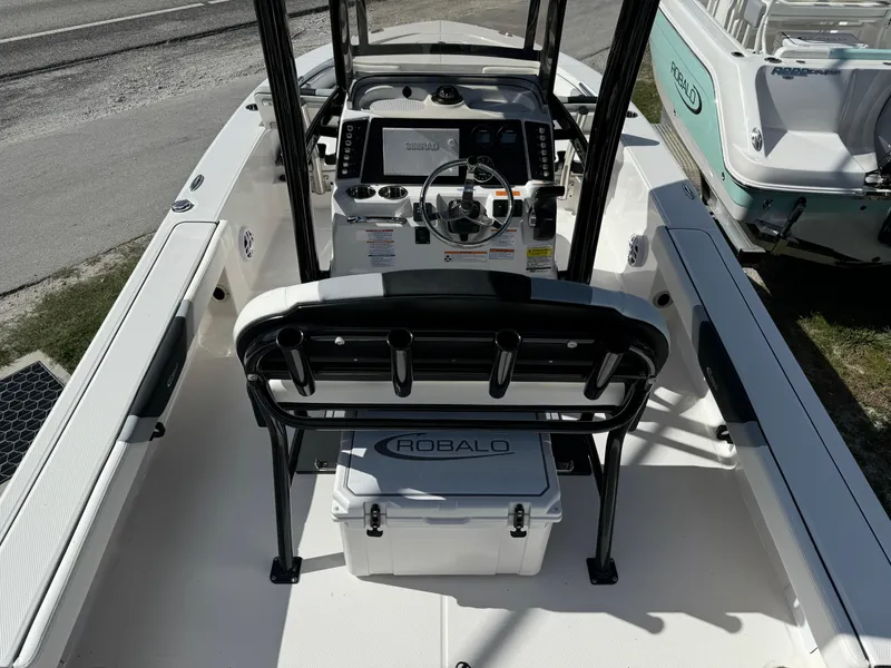 Slide: The Image of 2024 Robalo 226 Cayman boat interior with console and seating. - 5