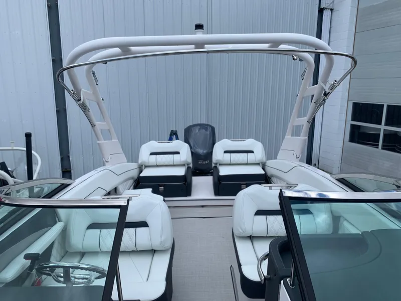 Slide: The Image of 2024 Regal LX4 boat with white interior and seating arrangement. - 20