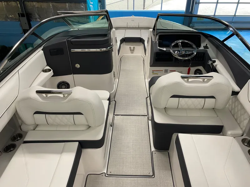 Slide: The Image of 2025 Regal LX6 boat interior with luxurious white seating and modern dashboard. - 4