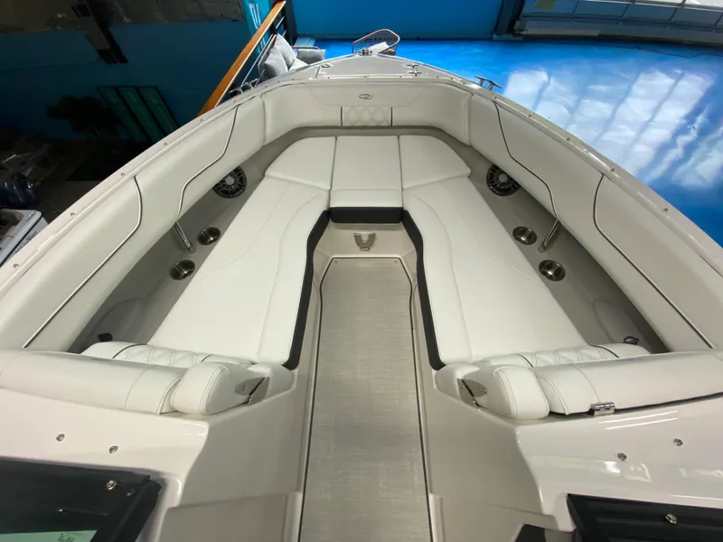 Slide: The Image of 2025 Regal LX6 boat interior with white seating and sleek design. - 6