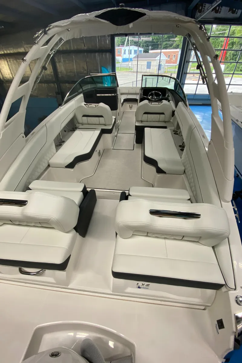 Slide: The Image of 2025 Regal LX6 boat interior with white seating and modern design. - 7
