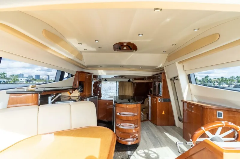 Slide: The Image of Luxurious interior of a 2006 Marquis 59 yacht with elegant wood finishes and modern amenities. - 19