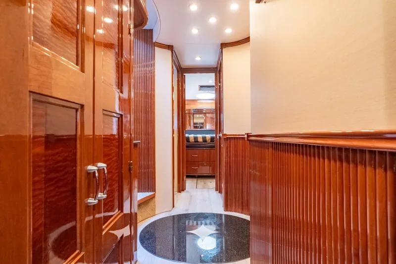 Slide: The Image of Luxurious interior hallway of a 2006 Marquis 59 yacht with polished wood finishes. - 30