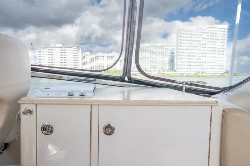 Slide: The Image of Interior view of a 2006 Marquis 59 yacht with cityscape through windows. - 8