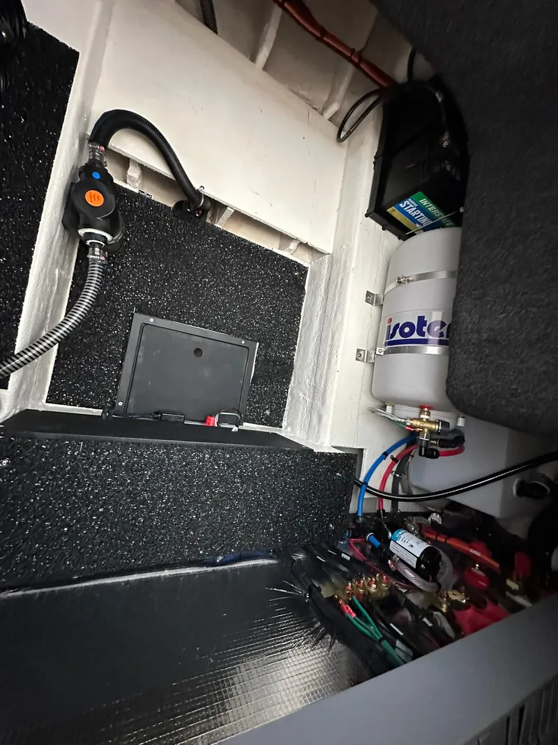 Slide: The Image of 2025 Regal 26XO engine compartment with wiring and components. - 12