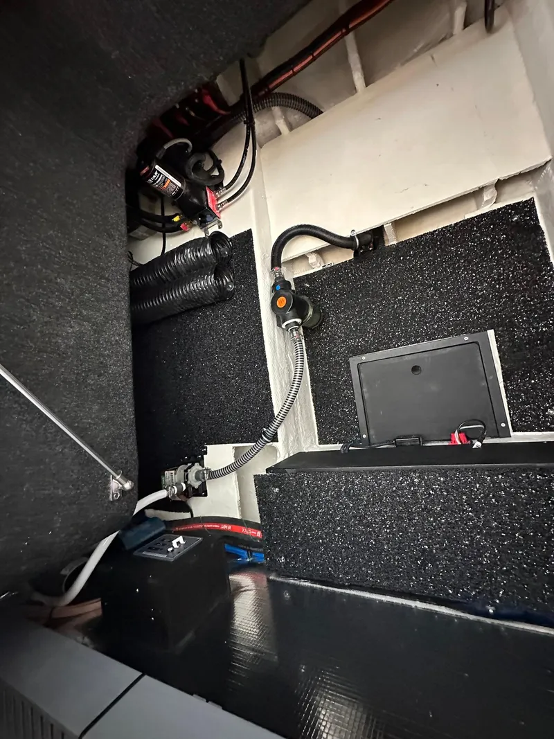 Slide: The Image of 2025 Regal 26XO boat interior wiring and components. - 13