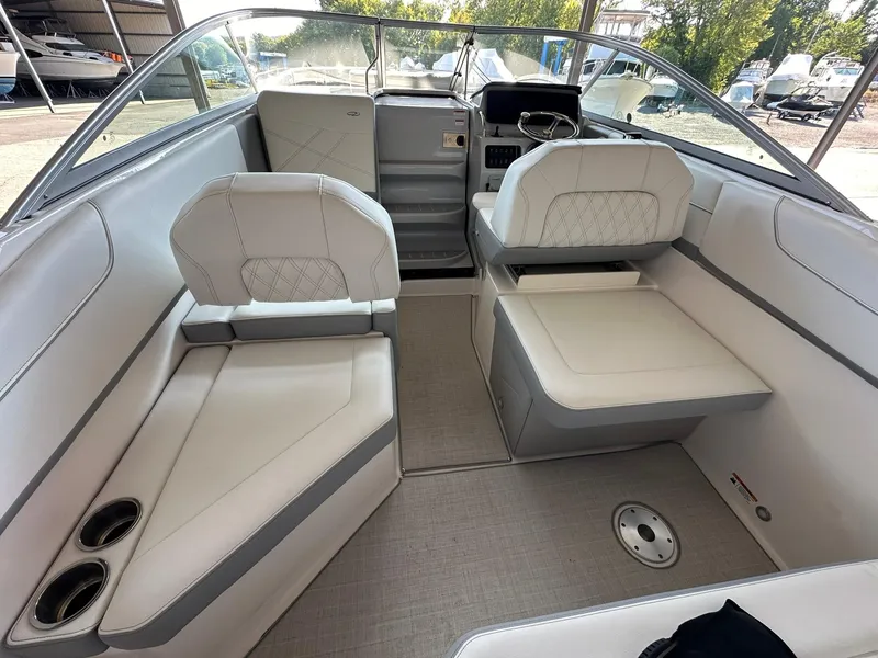 Slide: The Image of Interior of 2025 Regal 26XO boat with white seating and modern design. - 14