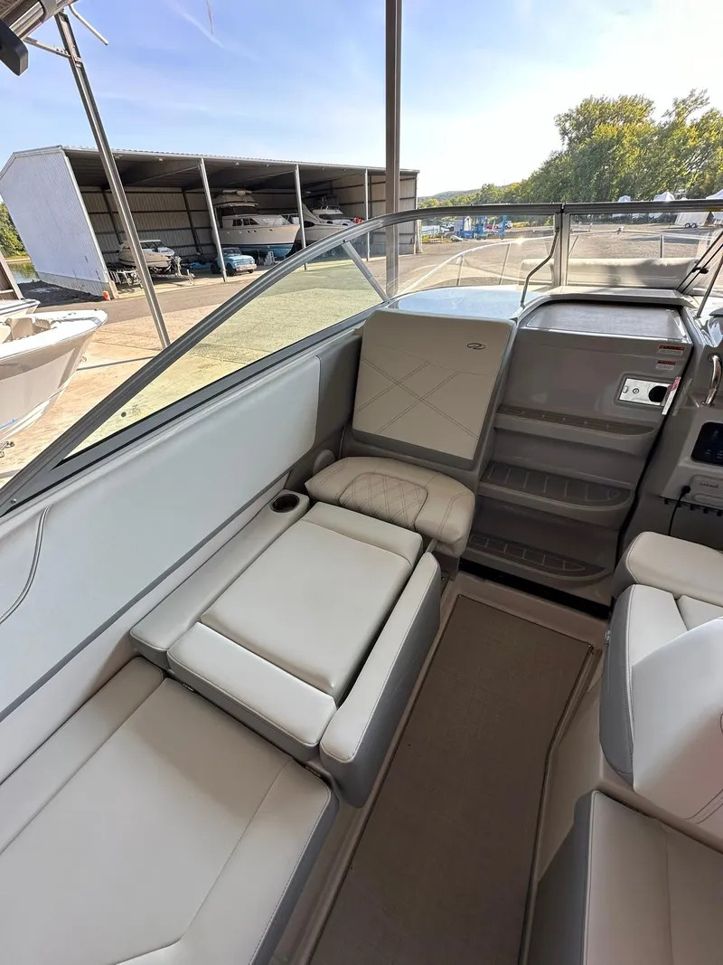 Slide: The Image of 2025 Regal 26XO boat interior with plush seating and modern design. - 17