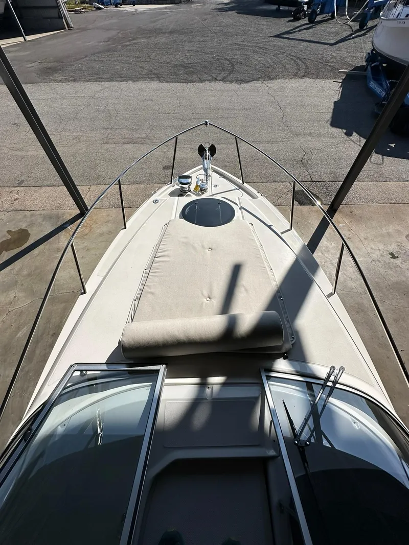 Slide: The Image of 2025 Regal 26XO boat deck view at marina. - 29