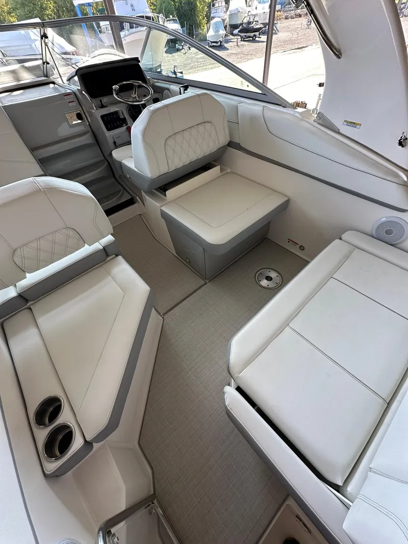 Slide: The Image of 2025 Regal 26XO boat interior with white seating and modern helm. - 8