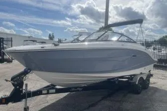 Slide: The Image of 2017 Sea Ray SPX 210 Outboard boat on trailer under cloudy sky. - 3