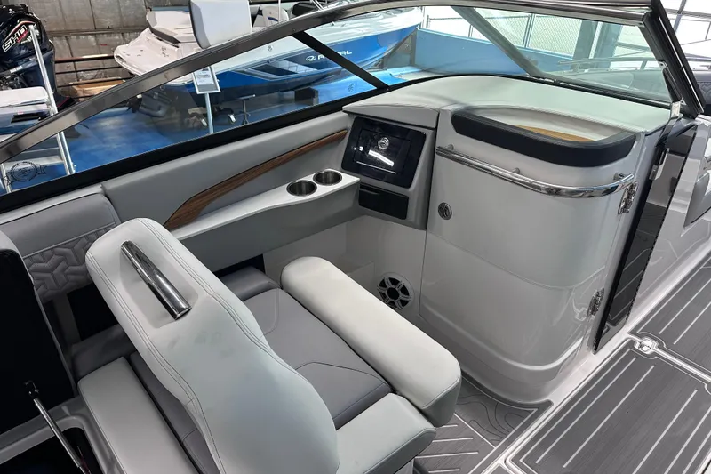 Slide: The Image of 2026 Regal LX9 boat interior with modern dashboard and seating. - 12
