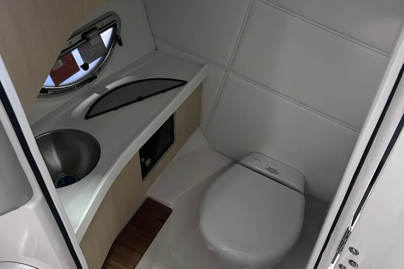 Slide: The Image of Modern bathroom in 2026 Regal LX9 boat with sink and toilet. - 13