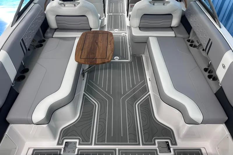 Slide: The Image of Luxurious 2026 Regal LX9 boat interior with sleek seating and elegant wooden table. - 8