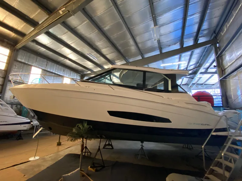 The Image of 2023 Regal 36XO yacht in indoor showroom. - 0