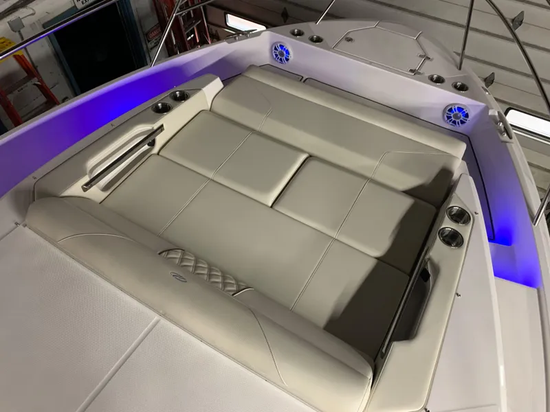 Slide: The Image of 2023 Regal 36XO boat with luxurious seating and blue LED lighting. - 20