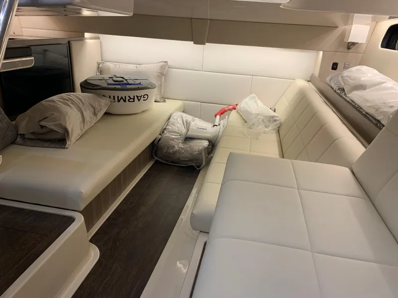 Slide: The Image of Interior cabin of 2023 Regal 36XO yacht with white leather seating. - 24
