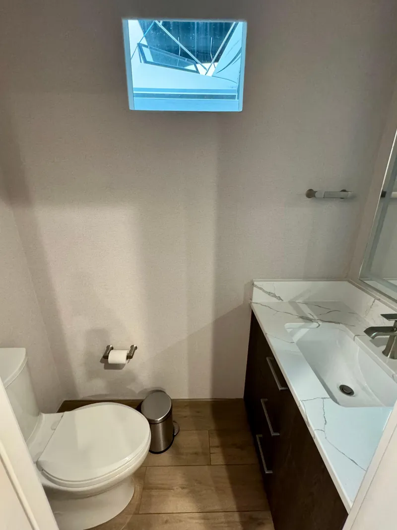 Slide: The Image of Compact bathroom in Adonia Pace Trip #7, 2021 model, featuring modern fixtures and a small window. - 17