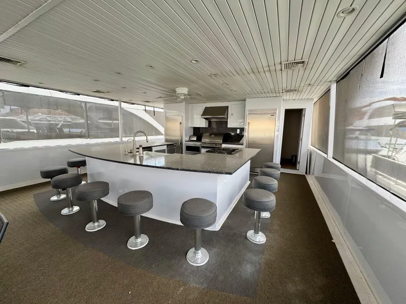 Slide: The Image of Modern kitchen area on Adonia Pace Trip #7 yacht, featuring bar stools and sleek design, 2021 model. - 32