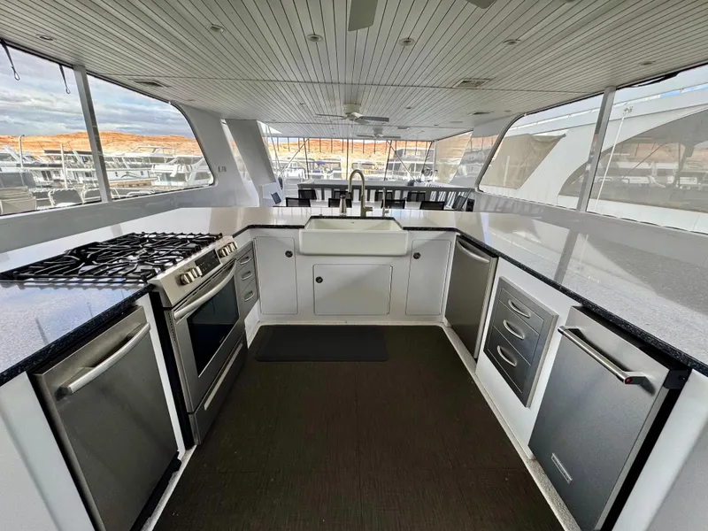 Slide: The Image of Modern kitchen interior on Adonia Pace Trip #7 houseboat, featuring stainless steel appliances, 2021 model. - 33