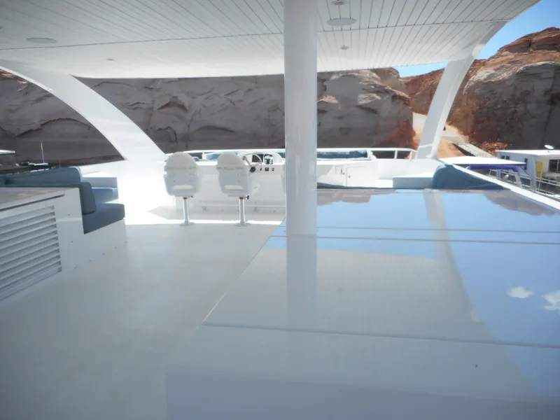 Slide: The Image of Luxurious Adonia Pace Trip #7 yacht interior, 2021 model, with sleek white design and scenic canyon backdrop. - 39