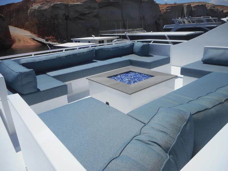 Slide: The Image of Luxurious seating area on Adonia Pace Trip #7 yacht, 2021, with blue cushions and fire pit. - 40