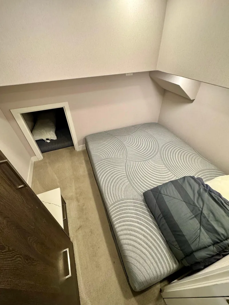 Slide: The Image of Compact bedroom in 2021 Adonia Pace Trip #7 with modern design and cozy bedding. - 5
