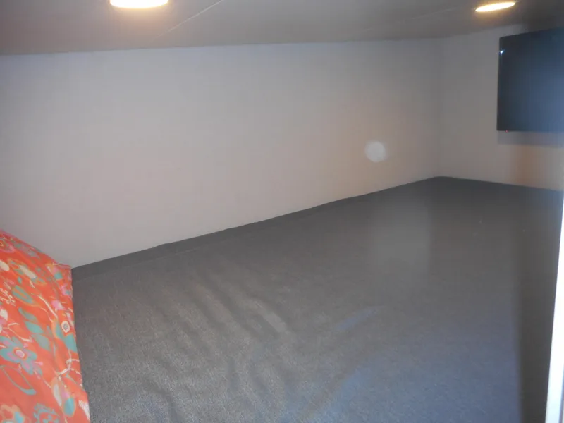 Slide: The Image of Interior of 2021 Adonia Pace Share #8 RV with spacious sleeping area. - 8