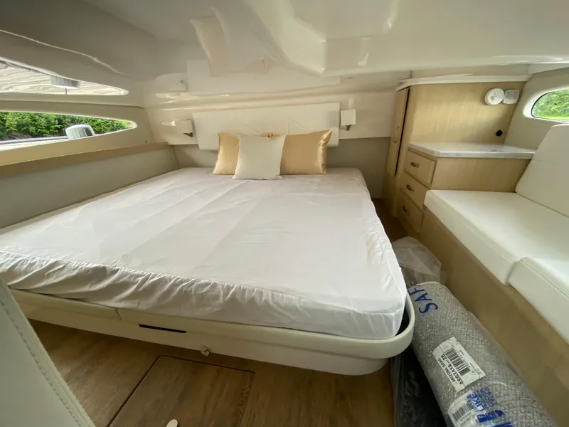 Slide: The Image of Luxurious bedroom interior of 2024 Regal 38XO yacht with modern furnishings. - 19